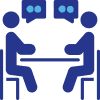 Two people sit across from each other at a table, each with a speech bubble above their heads with two dots, indicating a discussion about cybersecurity or incident response.